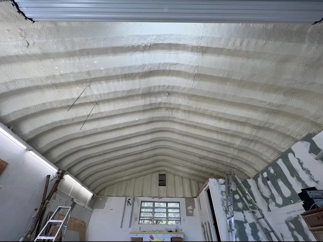 Spray polyurethane foam applied to the underside of a metal roof deck in Clyde